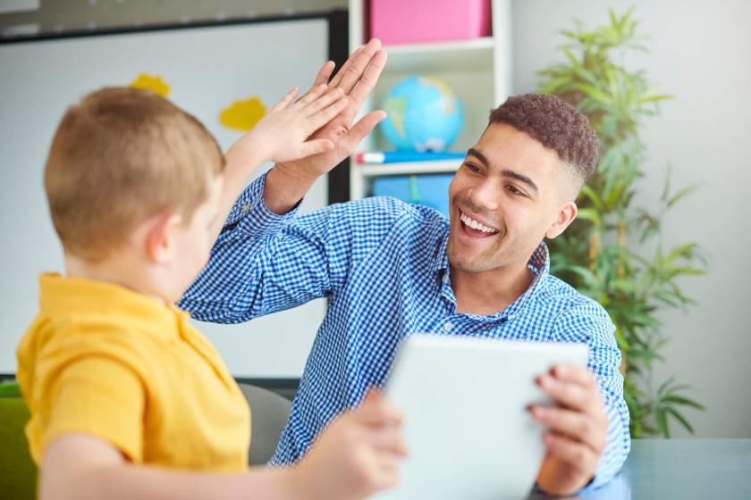 Teacher high fives student